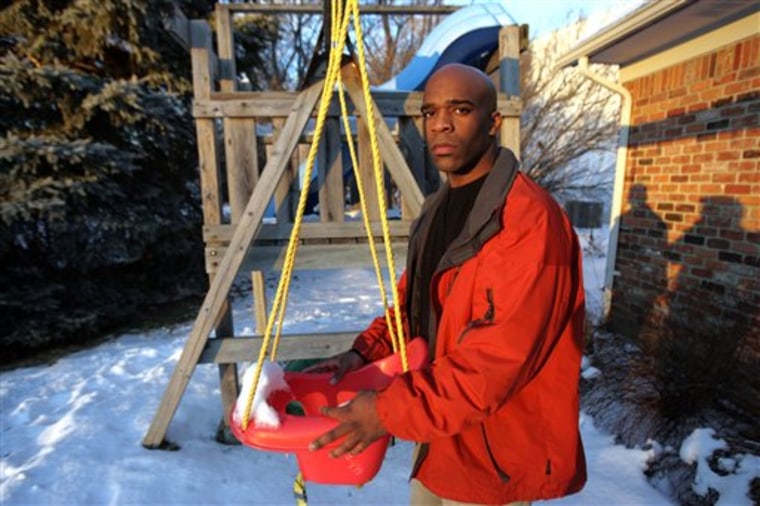 In this photo taken Dec. 22, 2010, Leon Walker, 33, stands next to the swing set he built for his 3-year-old daughter, Lailana Walker, outside Rochester Hills, Mich. home. Walker, who says he learned of his wife?s affair by reading her e-mail on their computer, faces trial Feb. 7. on felony computer misuse charges. (AP Photo/Detroit Free Press, Kimberly P. Mitchell) MANDATORY CREDIT, NO SALES, NO MAGS, DETROIT NEWS OUT